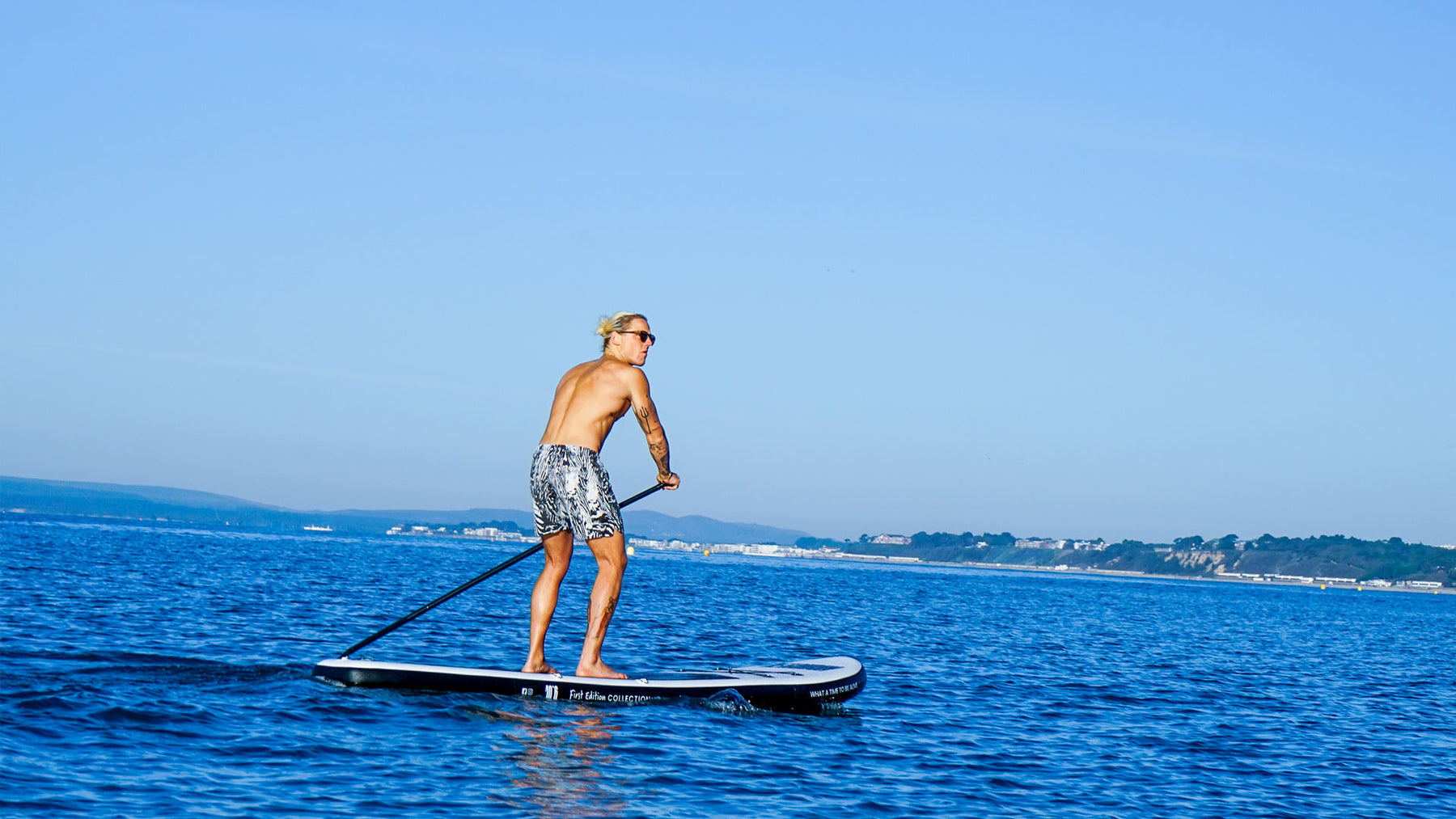 Men on Stand-up inflatable Beachbum® paddle board UK 